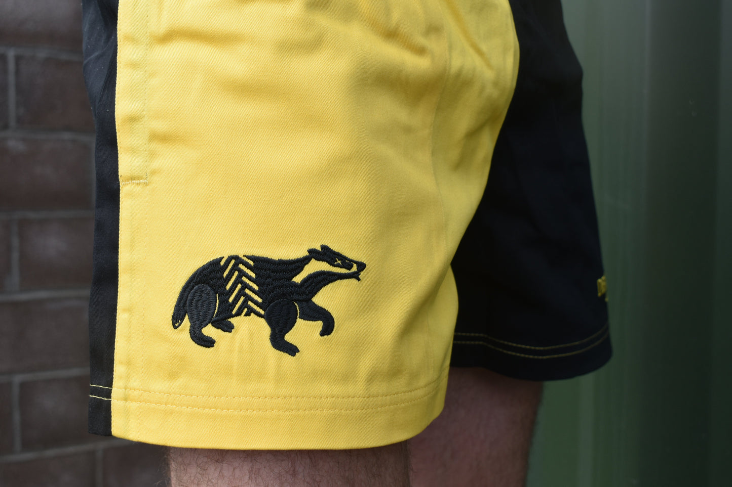 Dead Badger Clothing black and yellow shorts detail