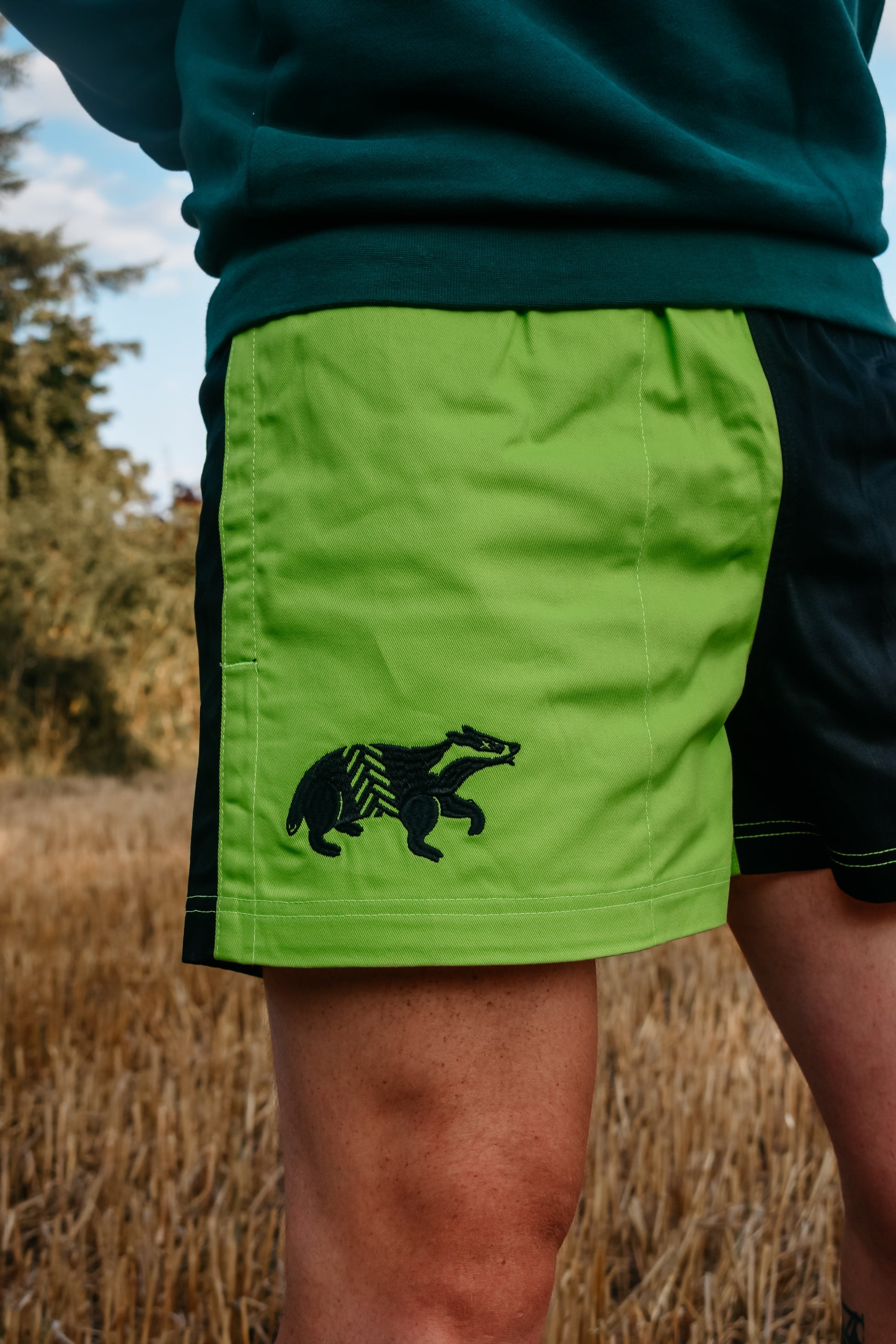 Dead Badger Clothing black and lime shorts close up