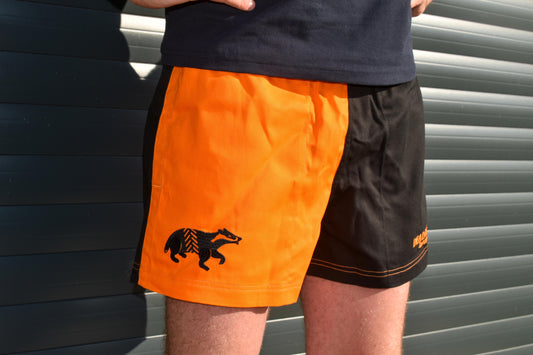 Dead Badger Clothing black and orange shorts close up